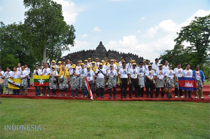 Participants pose in front of Borobudur, a heritage temple site in Indonesia. 